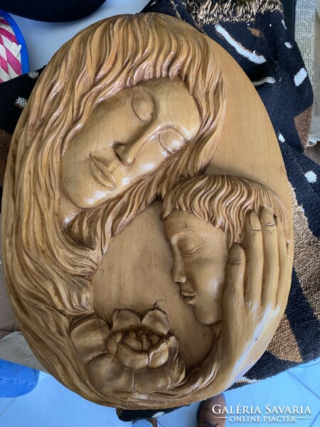 Mother and child wood carving on the wall