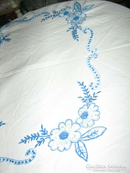 Beautiful vintage tablecloth embroidered with blue flowers