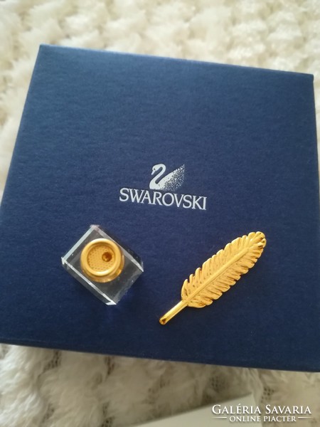 Swarovski crystal ornament, ink holder, pen.
