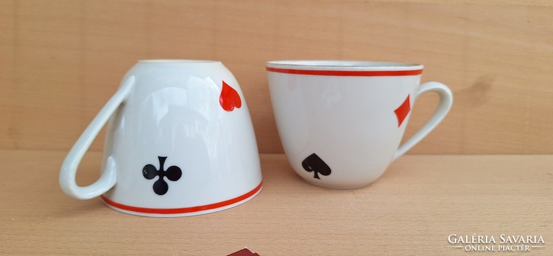 A pair of Zsolnay mugs with an old French card pattern