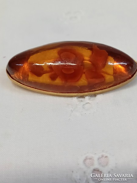 Vintage Baltic amber brooch with carved pattern