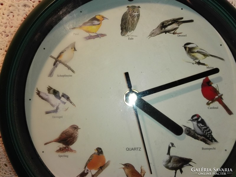 Wall clock with bird singing...