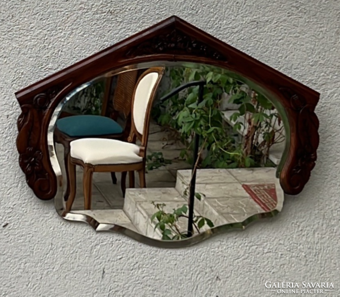 Wall mirror with exciting lines carved from antique oak wood with a polished mirror