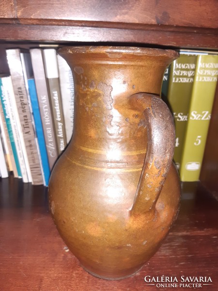 Glazed earthenware milk jug, guard