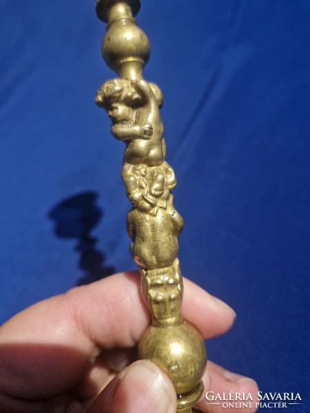 Copper candlestick in the shape of figural children or putts