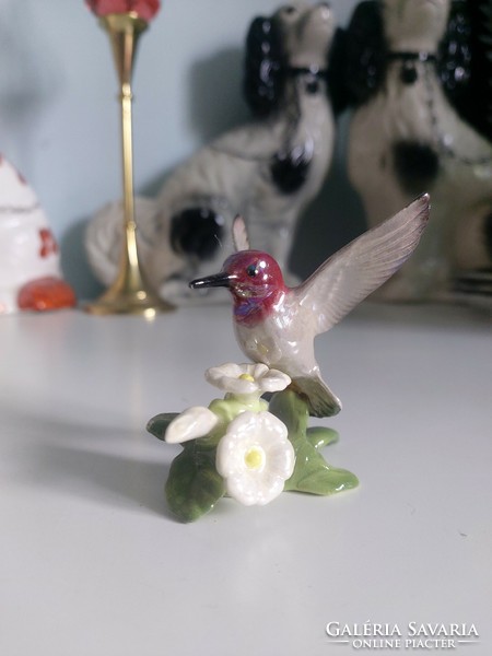 Discontinued hagen renaker, American porcelain hummingbird on flower. Nicely detailed, realistic