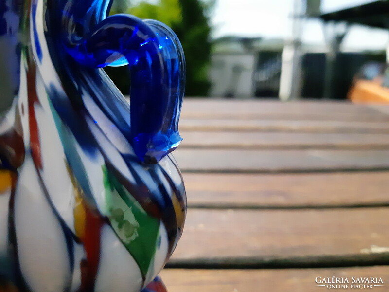 The old Murano style glass vase is damaged