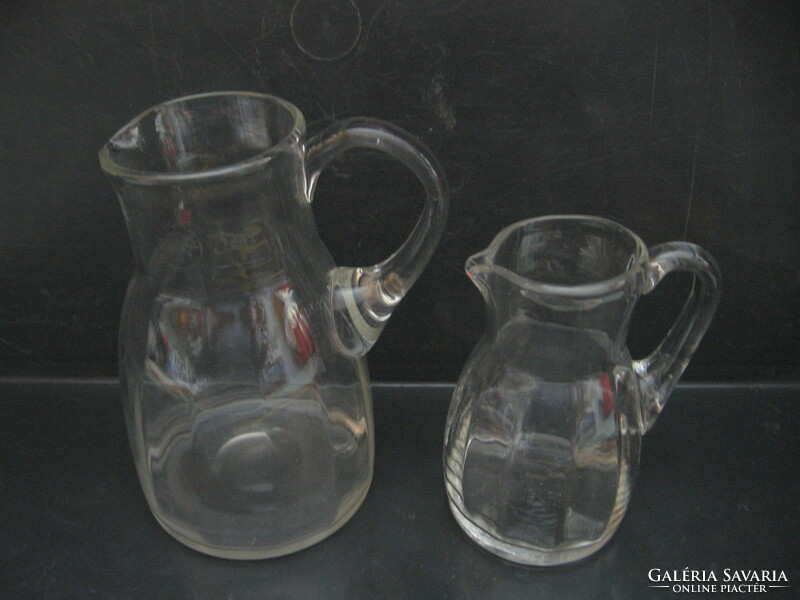 Antique blown ribbed jugs, crested, calibrated