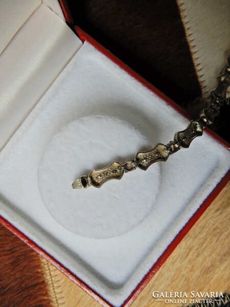 Old silver bracelet with sparkling stones