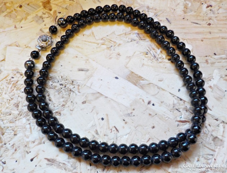 Old black glass necklace with decorative clasp