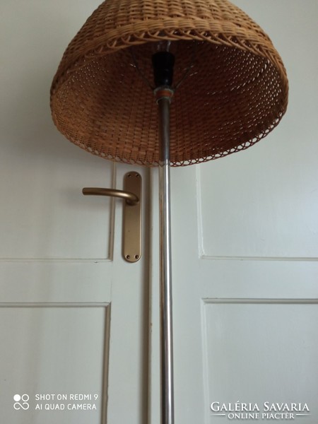 Mid-century floor lamp with a wicker shade