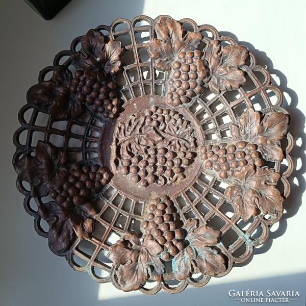 Copper or bronze bowl with grapes