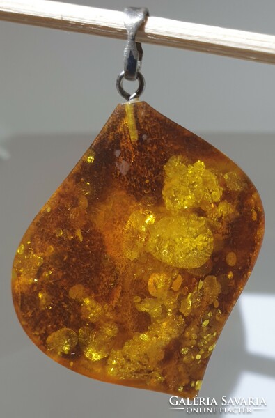 Old amber pendant with marked silver hanger