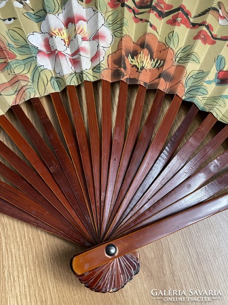 Beautiful wooden fan hand-painted on old large canvas.