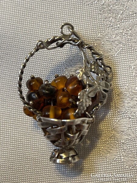 Beautiful silver basket with amber quills inside.