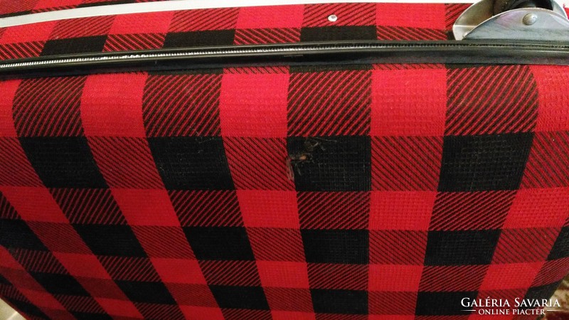 Retro giant suitcase - a massive, rolling, hard-lidded, checkered textile-covered suitcase