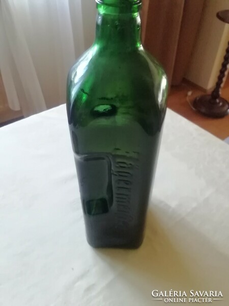 Jagermeister green bottle. With embossed inscription.