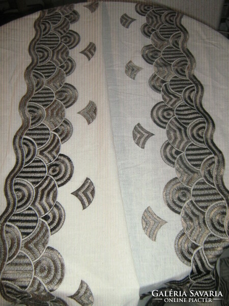 The material is embroidered material for tablecloths, curtains and decoration