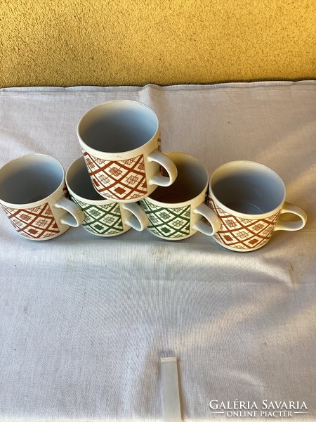 Five lowland porcelain mugs.