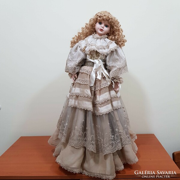 Porcelain doll in a wonderful dress