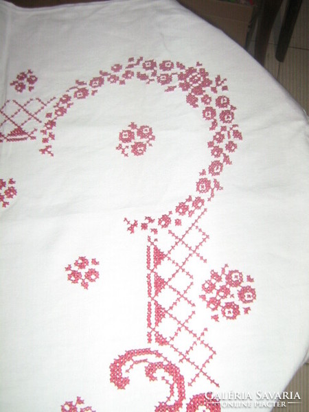 A tablecloth richly embroidered with a beautiful cross stitch