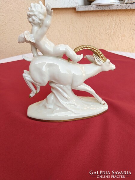 A putto riding a stone goat, a small putto with wings, an angel, very rare, flawless, no minimum price.