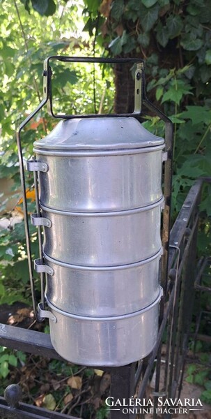 Old retro 4-part aluminum food barrel with food