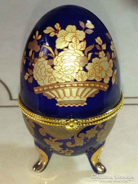 Beautiful cobalt blue, egg-shaped porcelain jewelry box with gold flower pattern