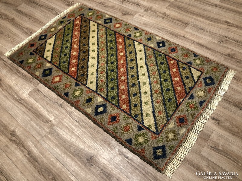 Thick hand-knotted wool rug, 104 x 187 cm