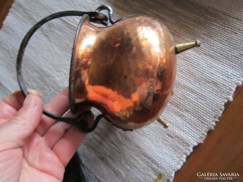 A small copper cauldron