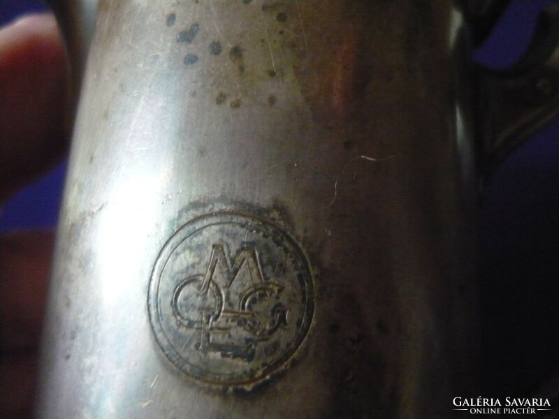 Antique metal spout with monogram