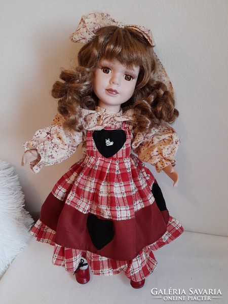 Brown curly porcelain doll 40 cm
