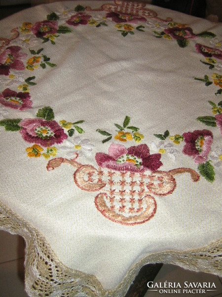 Beautifully embroidered tablecloth with beautiful floral lacy edges