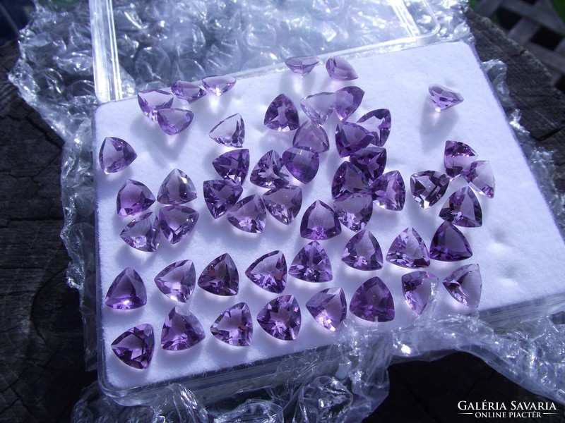 Faceted amethyst gemstones, triangle