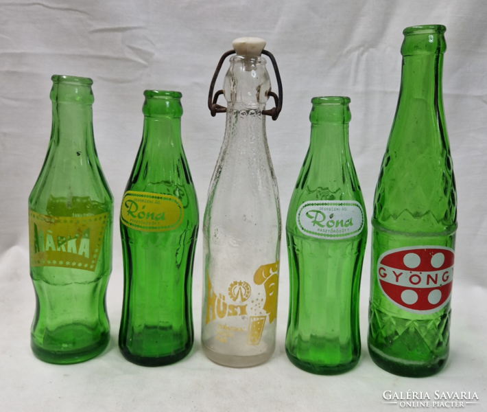 Retro carbonated soft drink bottles are sold together in good condition