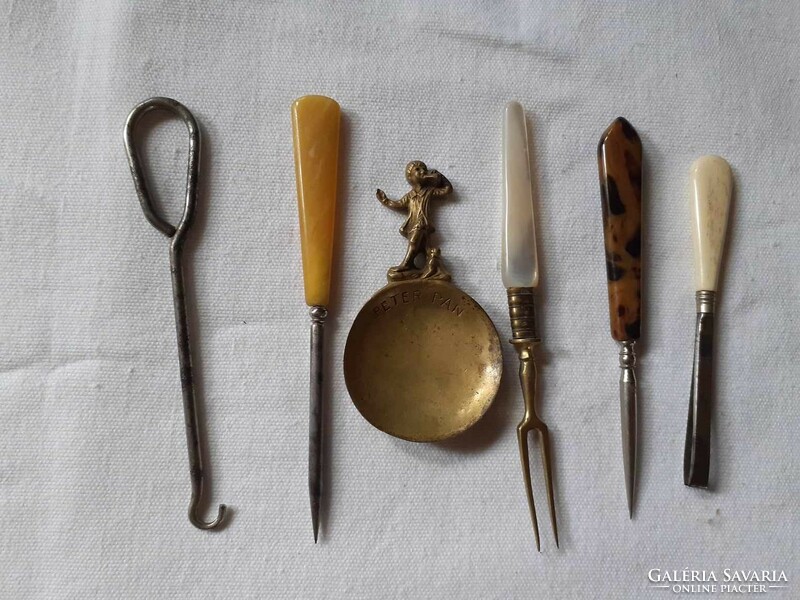 Old household items (glove button, tea spoon, tweezers, fork)