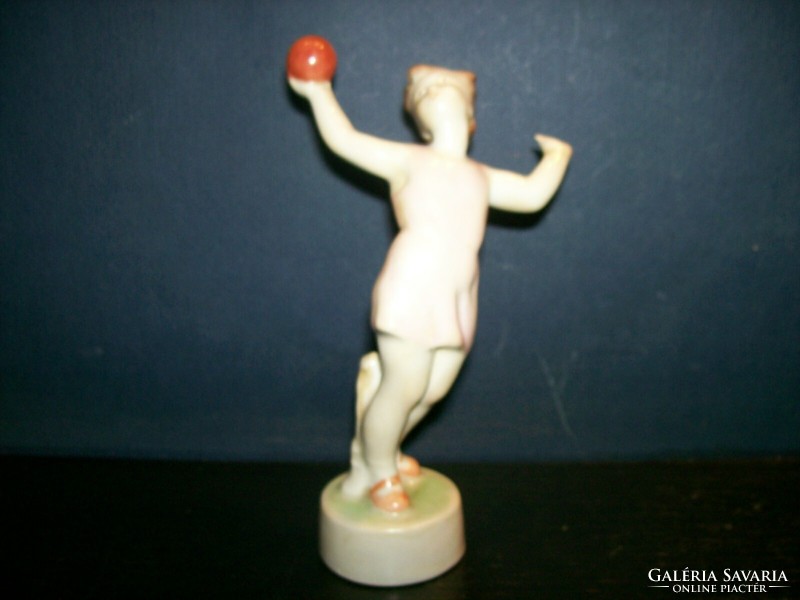 Zsolnay girl figure playing with a ball
