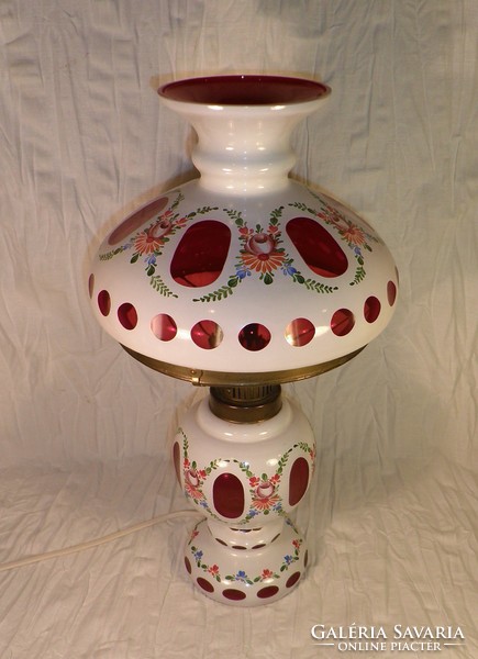 Old glass table with kerosene lamp