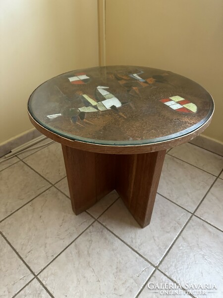 Round coffee table with painted copper sheet decoration