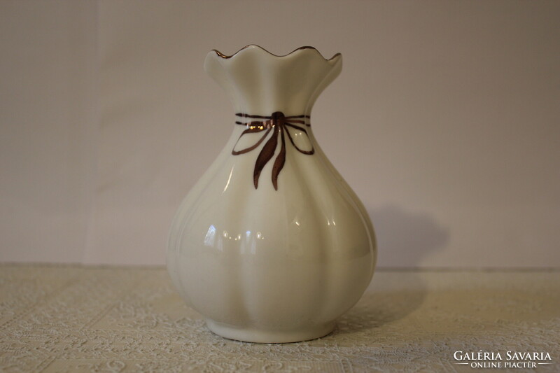White porcelain vase with gilded ribbon decoration