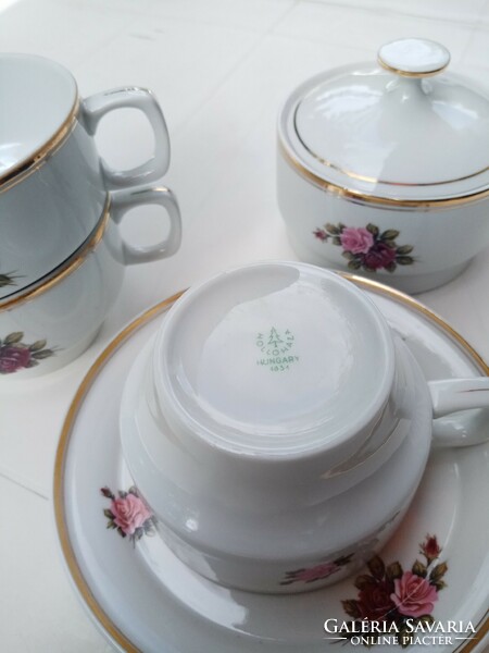 From a marked Hólloháza floral porcelain tea set: 3 cups, 1 saucer, 1 sugar bowl with lid
