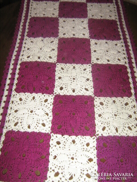 Beautiful hand-crocheted white-purple tablecloth with floral pattern