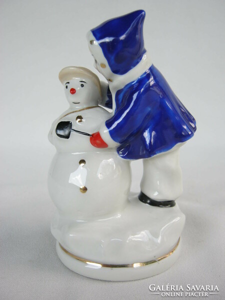 Child building a snowman retro Soviet porcelain