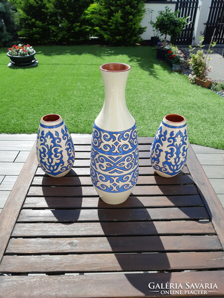 A trio of vases with a Middle Eastern pattern.