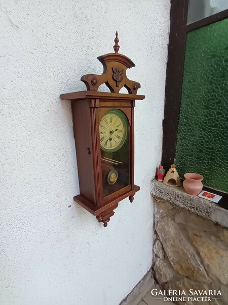 Antique German wall clock is beautiful