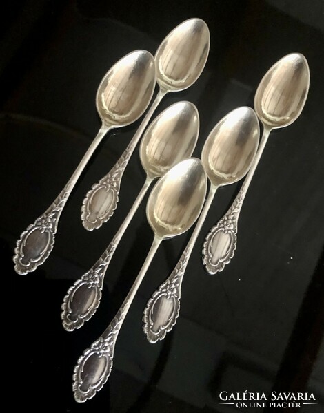 A set of silver-plated spoons richly decorated with a baroque pattern