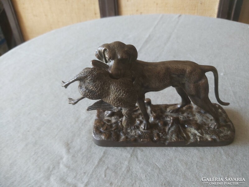 Old copper hunting dog with duck