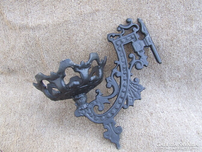 Old cast iron wall candlestick