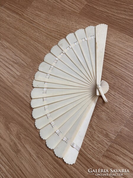 Antique scalloped-edge fan.