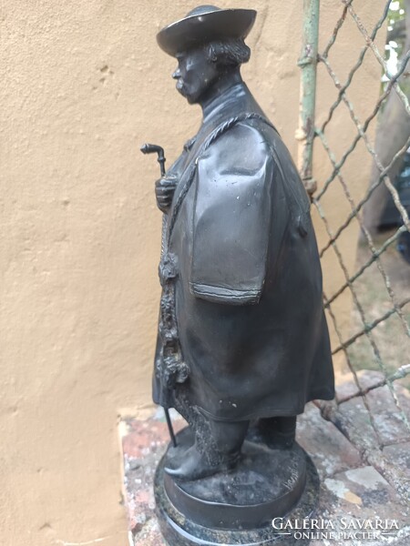 János László Beszédes Front Sculpture. Pipe-smoking Shepherd